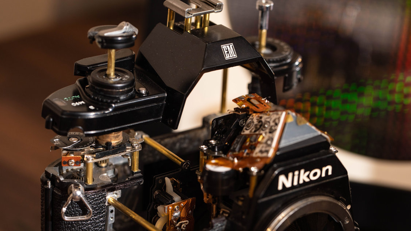 Disassembled Mechanical Film Camera Nikon EM: A Classic Camera Turned into Mechanical Art