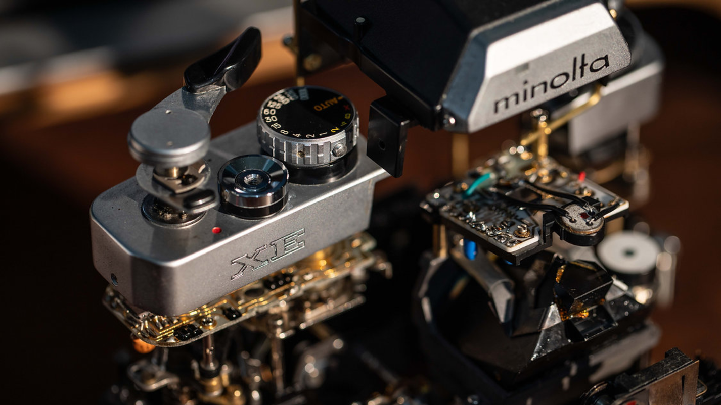 Disassembled Mechanical Film Camera Minolta XE: A Masterpiece of Engineering Revealed