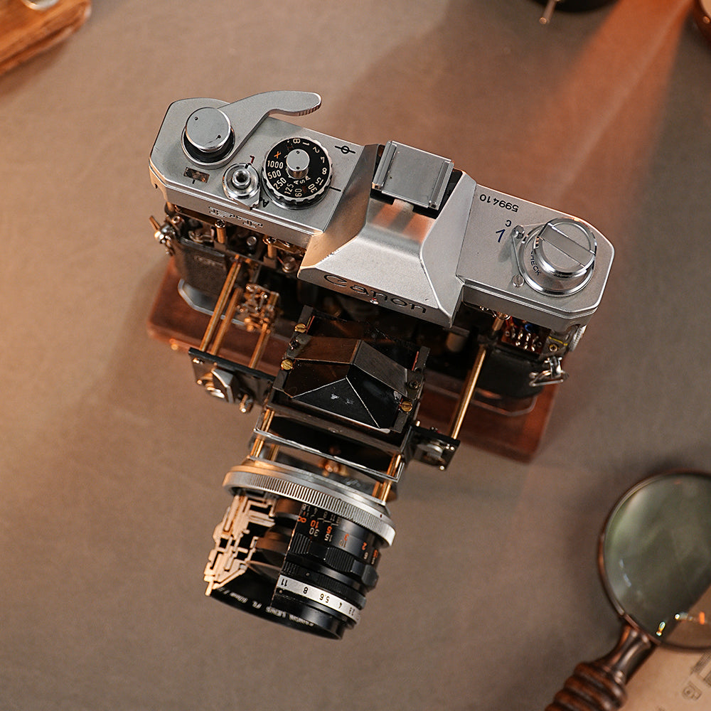 Disassembled Mechanical Film Camera Canon FT With Cut Lens