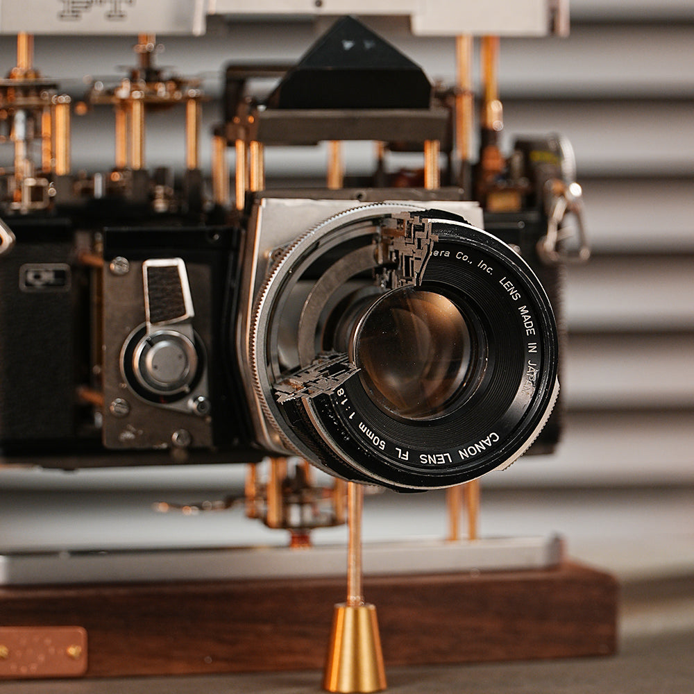 Disassembled Mechanical Film Camera Canon FT With Cut Lens