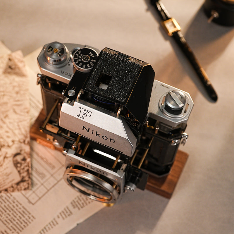 Disassembled Mechanical Film Camera Nikon F With cut lens