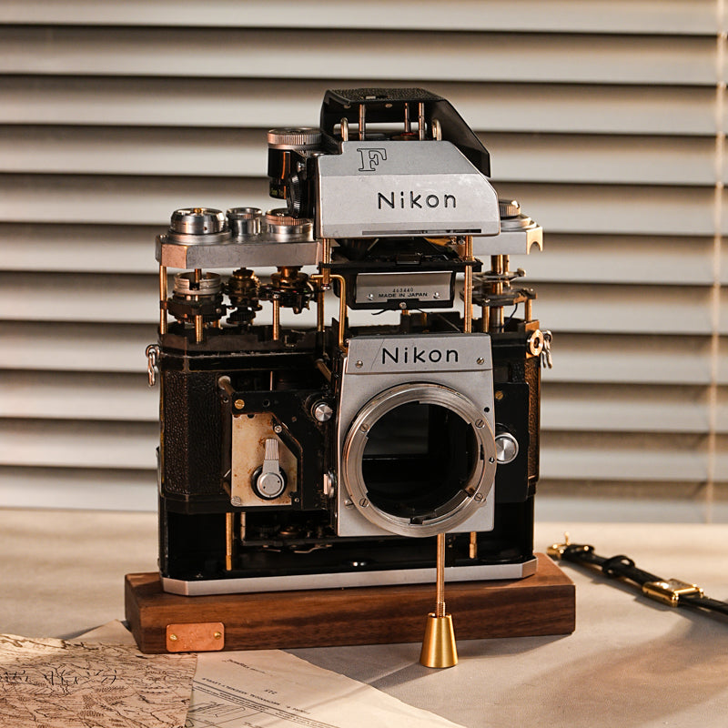 Disassembled Mechanical Film Camera Nikon F With cut lens