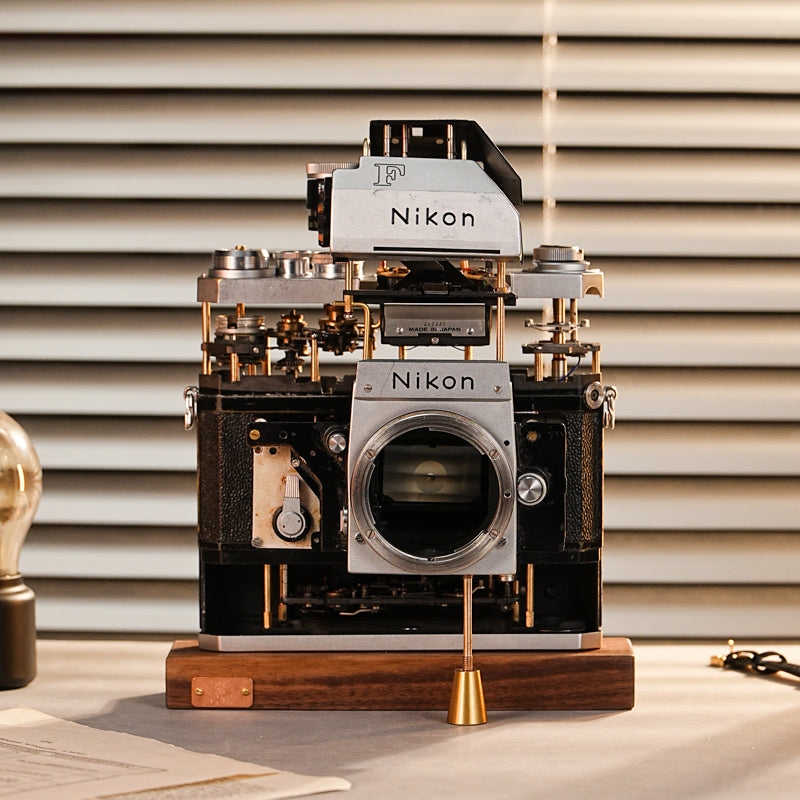 Disassembled Mechanical Film Camera Nikon F With cut lens