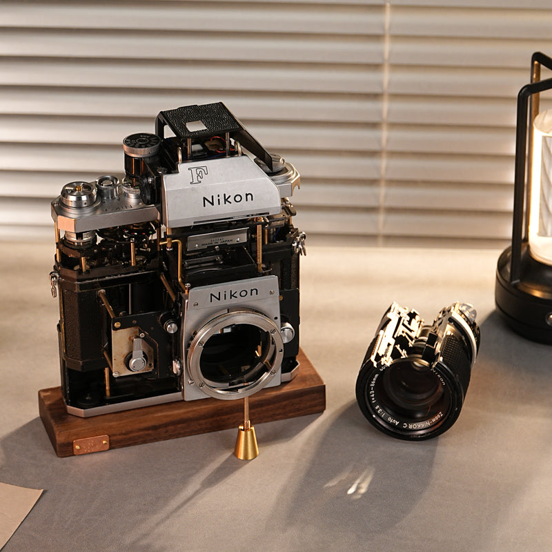 Disassembled Mechanical Film Camera Nikon F With cut lens