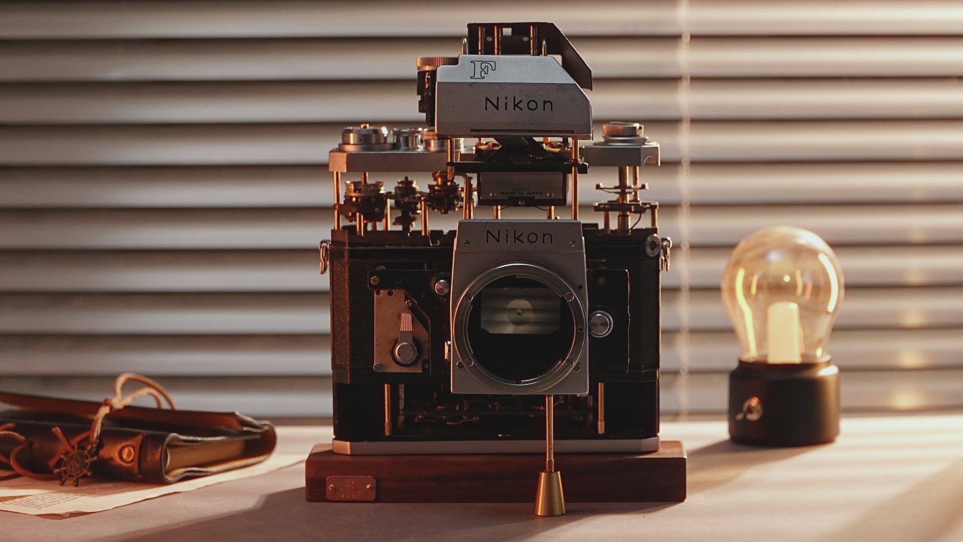 Disassembled Mechanical Film Camera Nikon F With cut lens